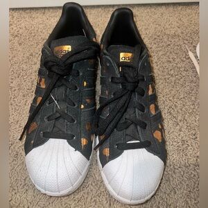 Adidas, size 6.5, black with gold spots